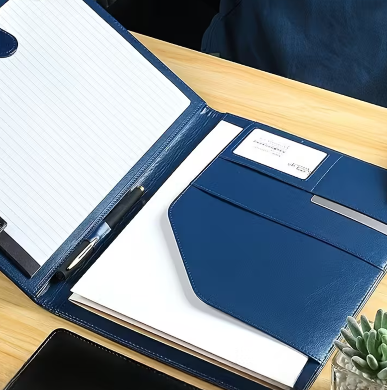 Business portfolio and notebook on a desk representing medical spa management